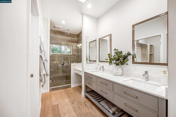 Bathroom, Dual Sink Vanities, Glass Shower, Interior, Recessed Lighting, Wood Texture Flooring