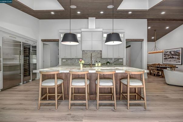 Dining room, Interior, Kitchen, Pendant Lights, Recessed Lighting, Stainless Steel Appliances, Wood Texture Flooring