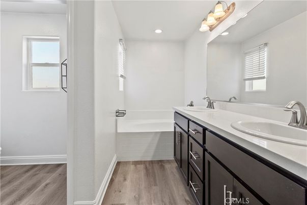 Bathroom, Dual Sink Vanities, Interior, Recessed Lighting, Wood Texture Flooring