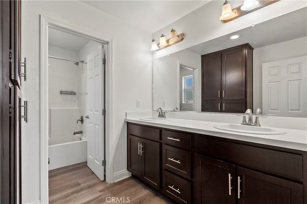 Bathroom, Dual Sink Vanities, Glass Shower, Interior, Wood Texture Flooring