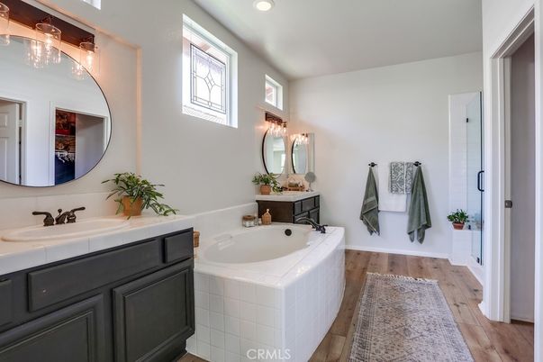 Bathroom, Dual Sink Vanities, Interior, Recessed Lighting, Tile Countertops, Wood Texture Flooring