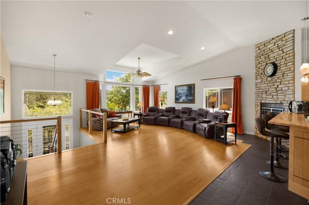 Fireplace, Interior, Living room, Pendant Lights, Recessed Lighting, Stone Walls, Wood Texture Flooring
