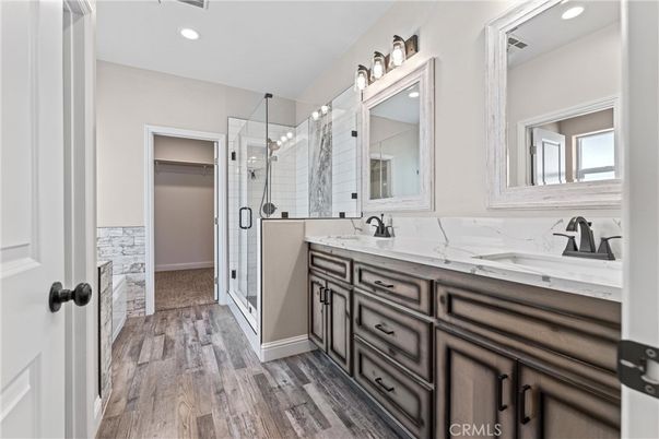 Bathroom, Dual Sink Vanities, Glass Shower, Interior, Recessed Lighting, Wood Texture Flooring