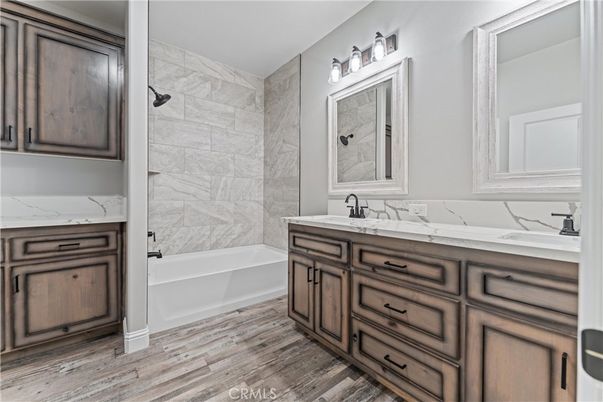 Bathroom, Dual Sink Vanities, Interior, Marble Walls, Wood Texture Flooring