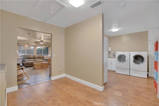 Interior, Living room, Utility Closets, Washer, Wood Texture Flooring