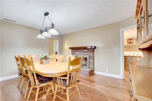 Dining room, Fireplace, Interior, Pendant Lights, Wood Texture Flooring