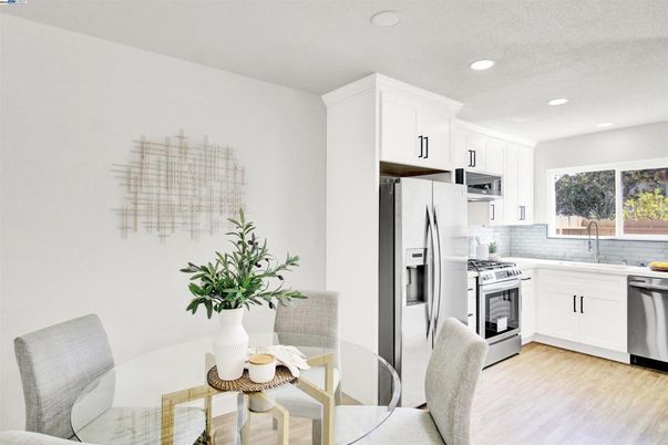 Dining room, Interior, Kitchen, Recessed Lighting, Stainless Steel Appliances, Wood Texture Flooring