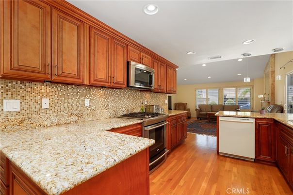 Dining room, Interior, Kitchen, Living room, Recessed Lighting, Stainless Steel Appliances, Wood Texture Flooring