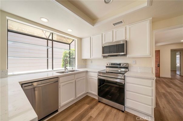 Interior, Kitchen, Recessed Lighting, Stainless Steel Appliances, Wood Texture Flooring