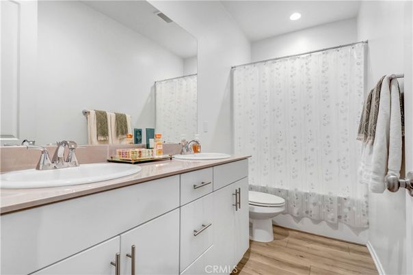 Bathroom, Dual Sink Vanities, Interior, Recessed Lighting, Wood Texture Flooring
