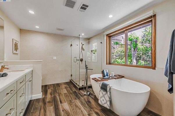 Bathroom, Free Standing Baths, Glass Shower, Interior, Recessed Lighting, Wood Texture Flooring