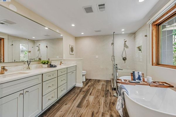 Bathroom, Dual Sink Vanities, Free Standing Baths, Glass Shower, Interior, Recessed Lighting, Wood Texture Flooring