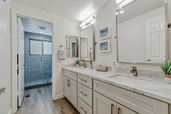 Bathroom, Dual Sink Vanities, Glass Shower, Interior, Recessed Lighting, Wood Texture Flooring