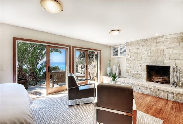 Bedroom, Fireplace, Interior, Recessed Lighting, Stone Walls, Water, Wood Texture Flooring