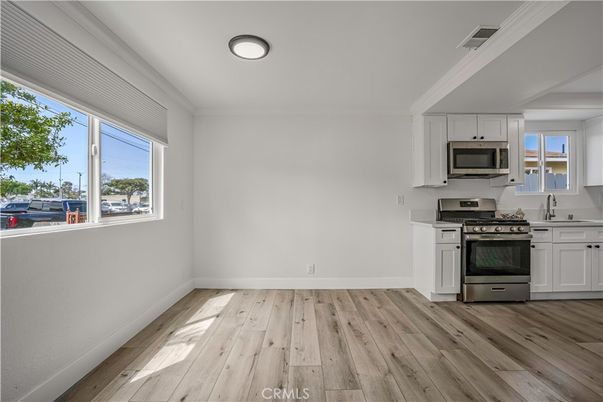 Empty room, Interior, Kitchen, Stainless Steel Appliances, Wood Texture Flooring
