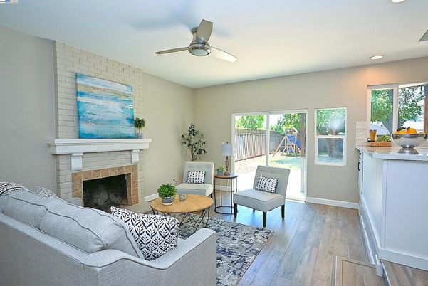 Fireplace, Interior, Living room, Recessed Lighting, Stone Walls, Wood Texture Flooring