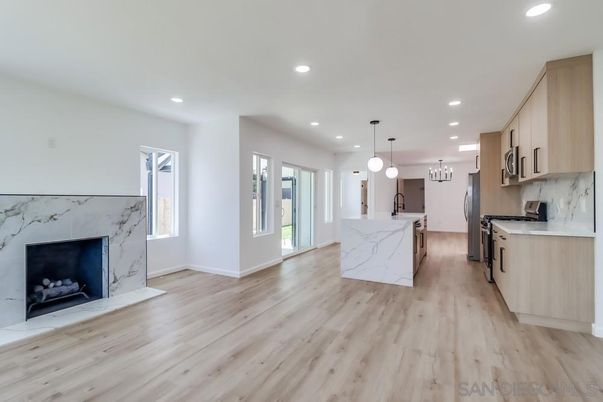 Fireplace, Interior, Kitchen, Marble Walls, Pendant Lights, Recessed Lighting, Wood Texture Flooring