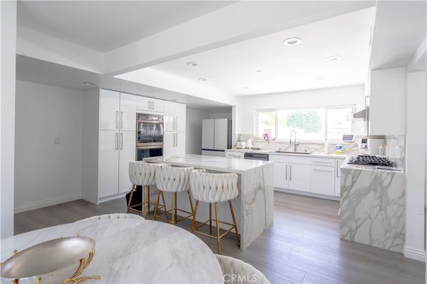 Interior, Kitchen, Marble Walls, Recessed Lighting, Stainless Steel Appliances, Wood Texture Flooring