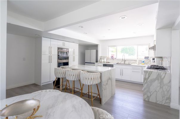 Interior, Kitchen, Marble Walls, Recessed Lighting, Stainless Steel Appliances, Wood Texture Flooring