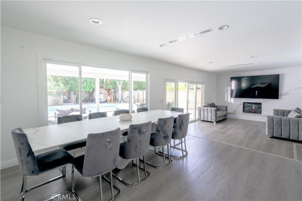 Dining room, Fireplace, Interior, Living room, Recessed Lighting, Wood Texture Flooring
