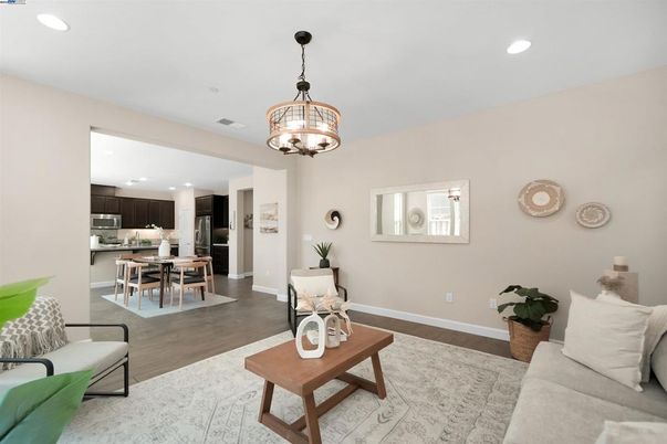Chandelier, Dining room, Interior, Kitchen, Living room, Pendant Lights, Recessed Lighting, Stainless Steel Appliances, Wood Texture Flooring