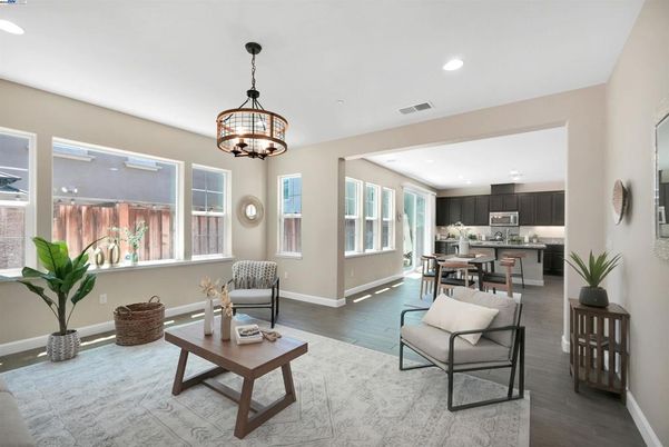 Chandelier, Dining room, Interior, Kitchen, Living room, Pendant Lights, Recessed Lighting, Stainless Steel Appliances, Wood Texture Flooring