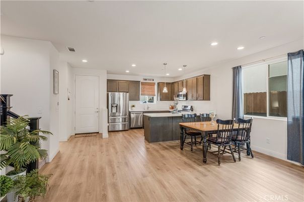 Dining room, Interior, Kitchen, Pendant Lights, Recessed Lighting, Stainless Steel Appliances, Wood Texture Flooring