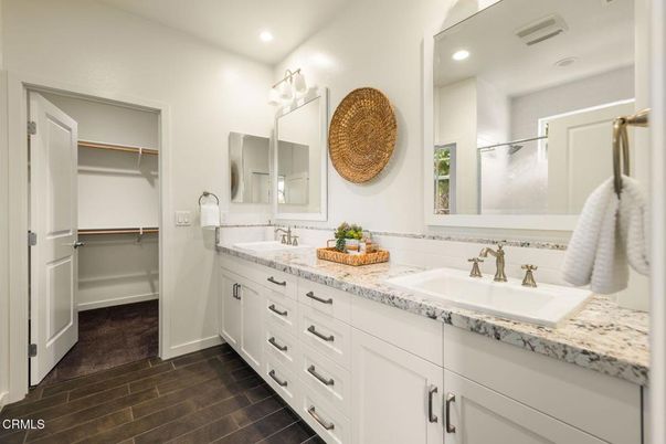 Bathroom, Dual Sink Vanities, Interior, Recessed Lighting, Walk-in Closets, Wood Texture Flooring