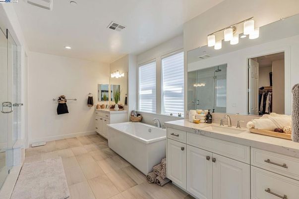 Bathroom, Dual Sink Vanities, Free Standing Baths, Interior, Recessed Lighting, Wood Texture Flooring
