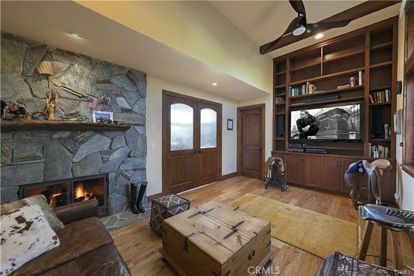 Fireplace, Interior, Living room, Recessed Lighting, Stone Walls, Wood Texture Flooring