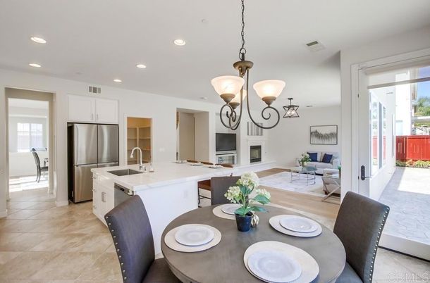 Chandelier, Dining room, Fireplace, Interior, Kitchen, Living room, Pendant Lights, Recessed Lighting, Stainless Steel Appliances