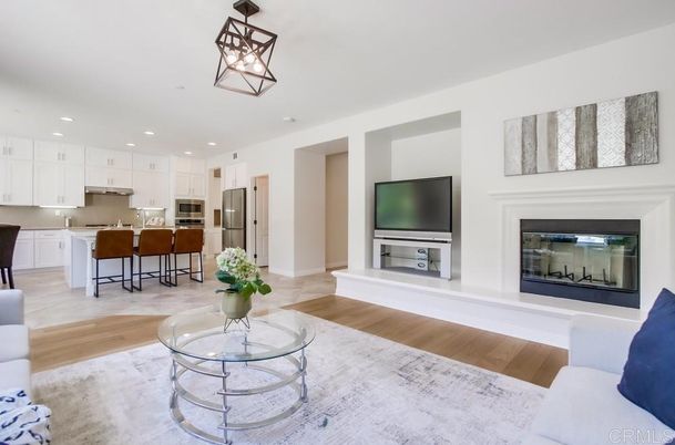 Fireplace, Interior, Kitchen, Living room, Pendant Lights, Recessed Lighting, Stainless Steel Appliances, Wood Texture Flooring