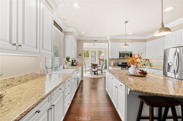 Dining room, Interior, Kitchen, Pendant Lights, Recessed Lighting, Stainless Steel Appliances, Wood Texture Flooring
