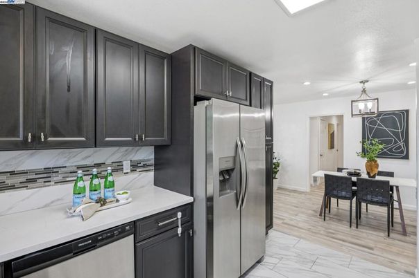 Dining room, Interior, Kitchen, Marble, Pendant Lights, Recessed Lighting, Stainless Steel Appliances, Wood Texture Flooring
