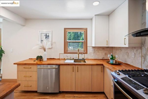 Interior, Kitchen, Marble Walls, Recessed Lighting, Stainless Steel Appliances, Wood Texture Flooring