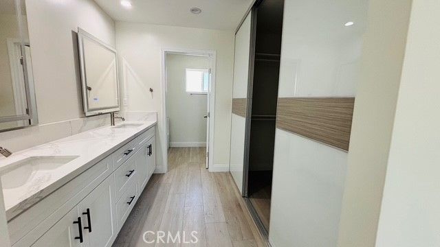 Bathroom, Dual Sink Vanities, Interior, Recessed Lighting, Wood Texture Flooring