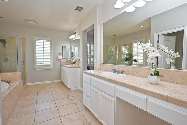 Bathroom, Dual Sink Vanities, Glass Shower, Interior, Recessed Lighting, Tile Countertops