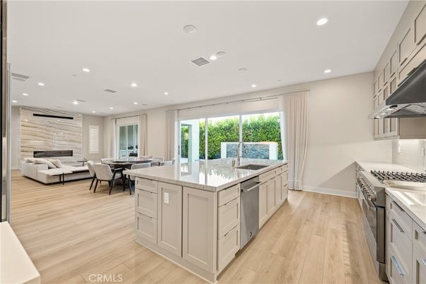 Dining room, Interior, Kitchen, Living room, Recessed Lighting, Stainless Steel Appliances, Wood Texture Flooring