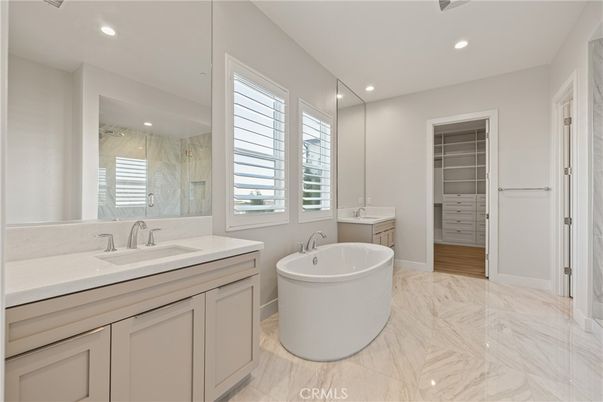 Bathroom, Dual Sink Vanities, Free Standing Baths, Interior, Marble, Marble Walls, Recessed Lighting, Walk-in Closets