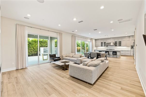 Dining room, Interior, Kitchen, Living room, Recessed Lighting, Stainless Steel Appliances, Wood Texture Flooring