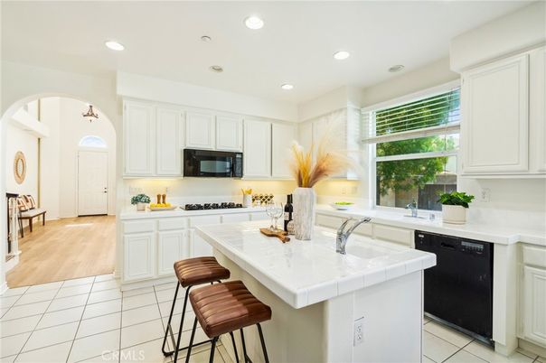 Interior, Kitchen, Recessed Lighting, Tile Countertops, Wood Texture Flooring