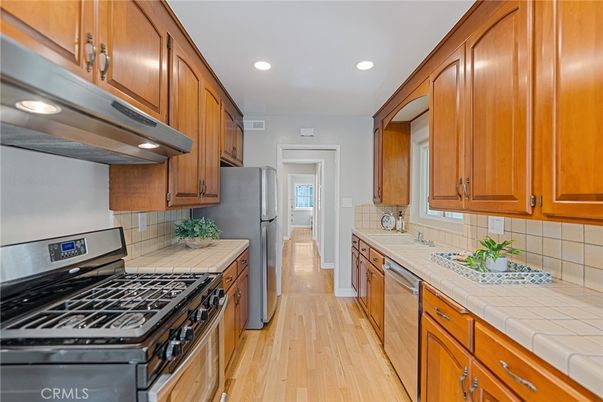 Interior, Kitchen, Recessed Lighting, Tile Countertops, Wood Texture Flooring