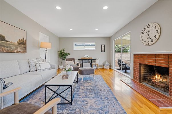 Dining room, Fireplace, Interior, Living room, Recessed Lighting, Wood Texture Flooring