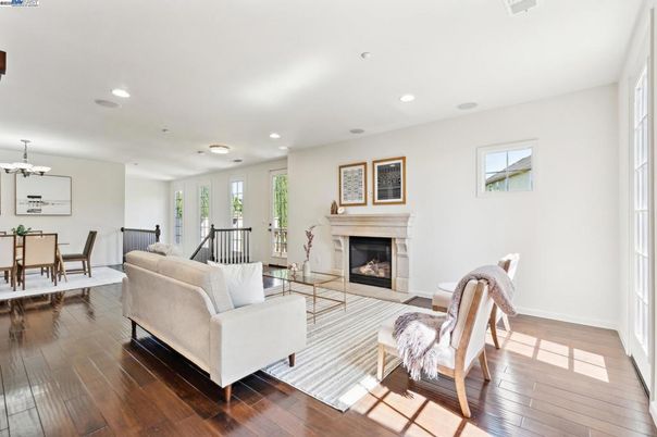 Chandelier, Dining room, Fireplace, Interior, Living room, Recessed Lighting, Wood Texture Flooring