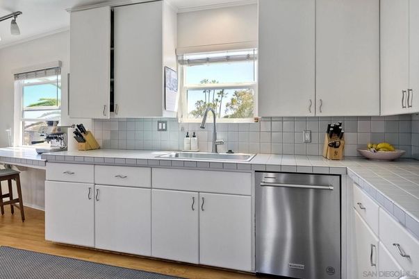 Interior, Kitchen, Stainless Steel Appliances, Tile Countertops, Wood Texture Flooring