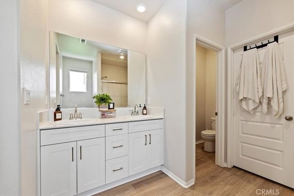 Bathroom, Dual Sink Vanities, Interior, Recessed Lighting, Wood Texture Flooring
