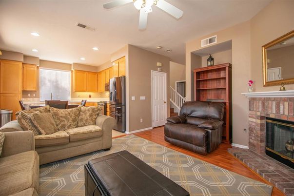 Dining room, Fireplace, Interior, Kitchen, Living room, Recessed Lighting, Stainless Steel Appliances, Wood Texture Flooring