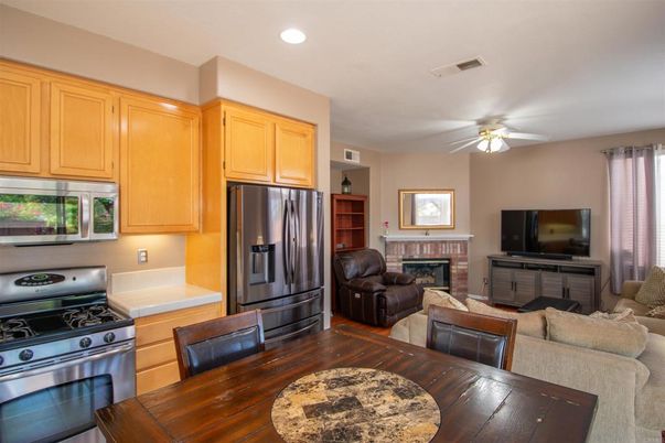 Fireplace, Interior, Kitchen, Living room, Recessed Lighting, Stainless Steel Appliances, Wood Texture Flooring