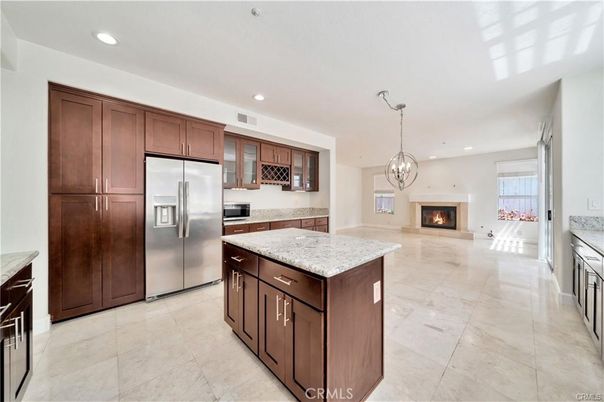 Chandelier, Fireplace, Interior, Kitchen, Pendant Lights, Recessed Lighting, Stainless Steel Appliances
