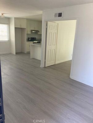 Empty room, Interior, Kitchen, Stainless Steel Appliances, Wood Texture Flooring